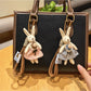 Stylish rabbit charm keychain with silver metal ring on white background
