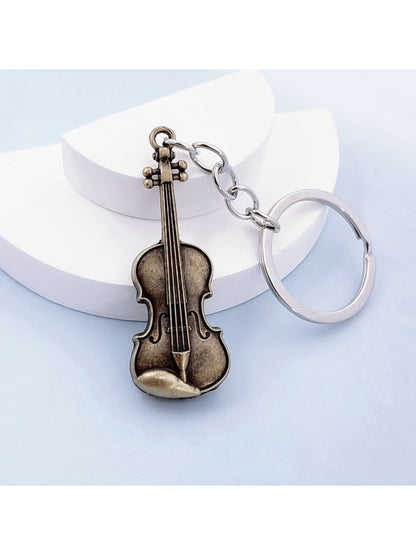 Vintage alloy guitar keychain displayed on a white background with clear lighting