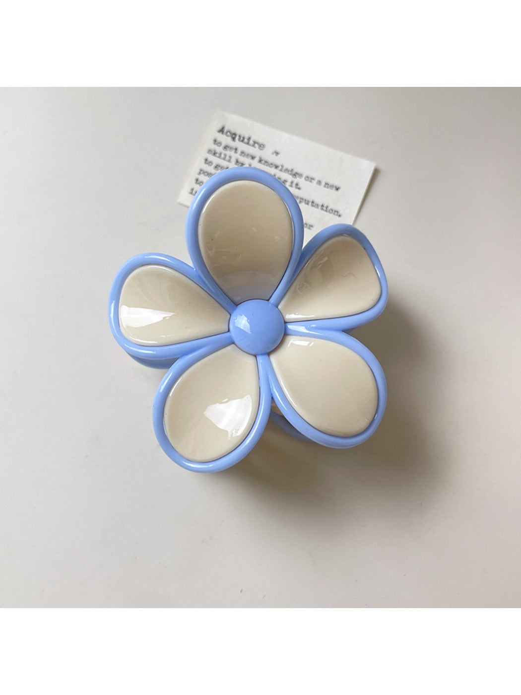 Beau flower shaped claw clip photographed from above showing full flower shape