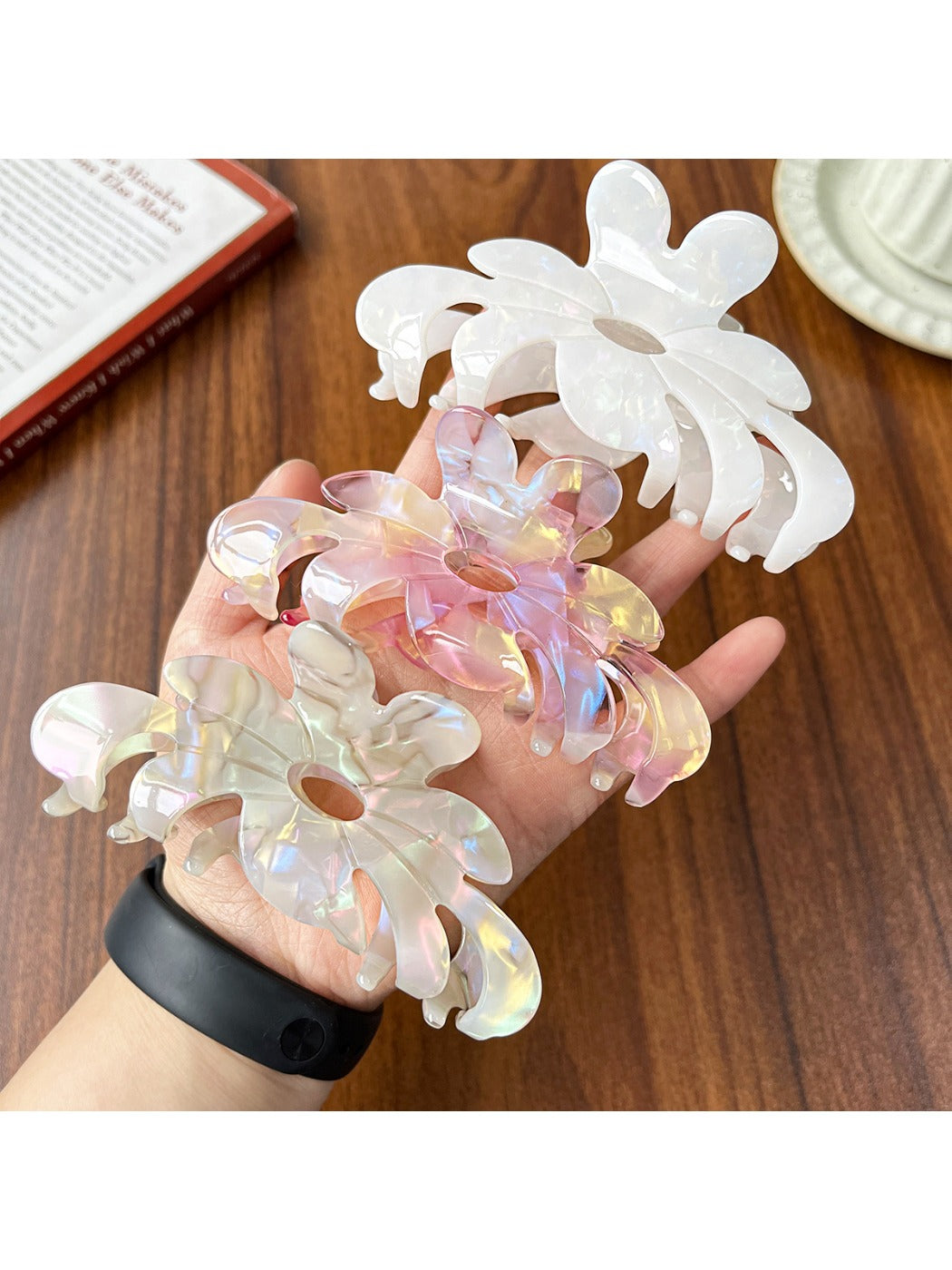 Close-up of Beau flower shaped claw clip showing petal details in pink