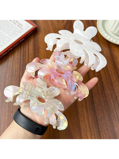 Close-up of Beau flower shaped claw clip showing petal details in pink