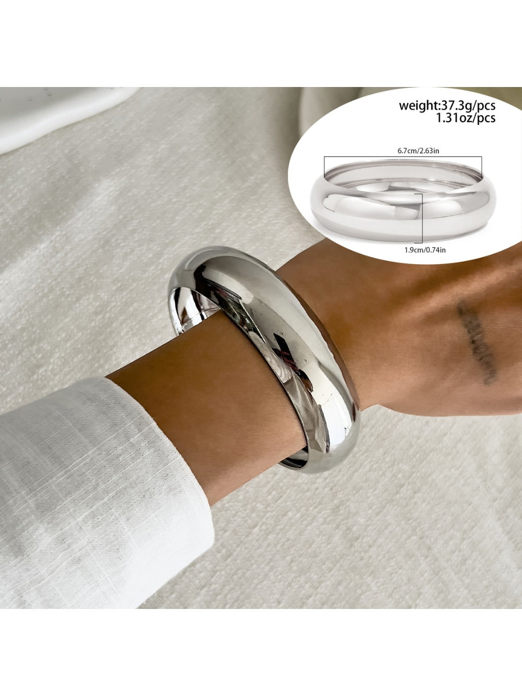 Lovra vintage polished irregular bangle bracelet angled to show polished finish