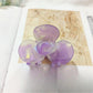 Beau Sweet Acetate Medium Flower Claw Clip angled to show translucent acetate material