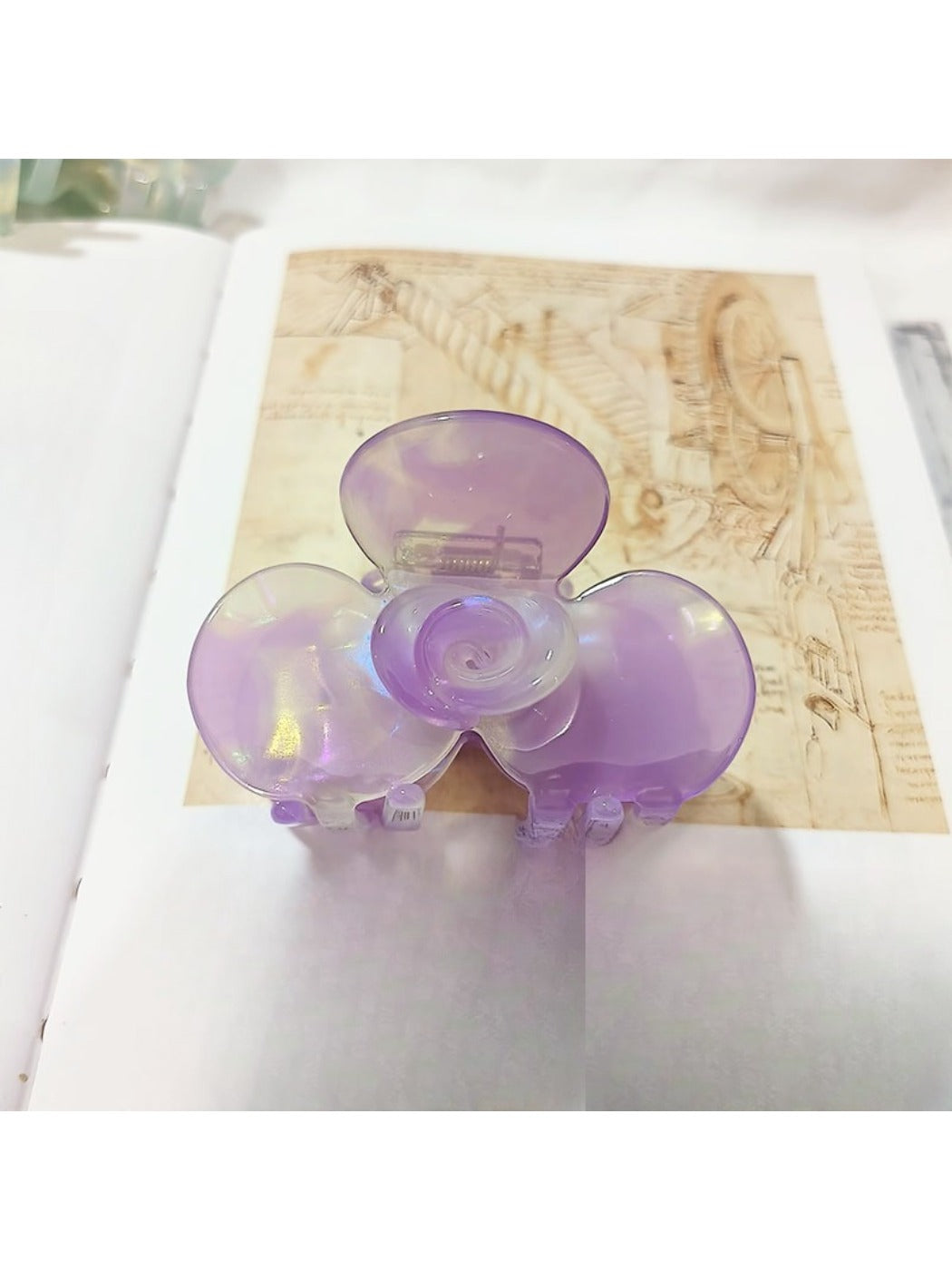Beau Sweet Acetate Medium Flower Claw Clip angled to show translucent acetate material
