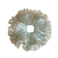 Side view of Gifty tulle ruffle scrunchie highlighting layered fabric and elastic band