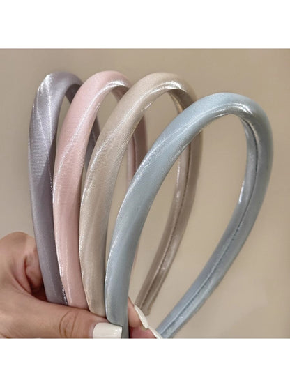 Smooth bright satin headband in vibrant pink displayed on a white background