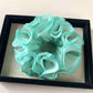 Gifty ruffle scrunchie shown in natural light emphasizing fabric softness