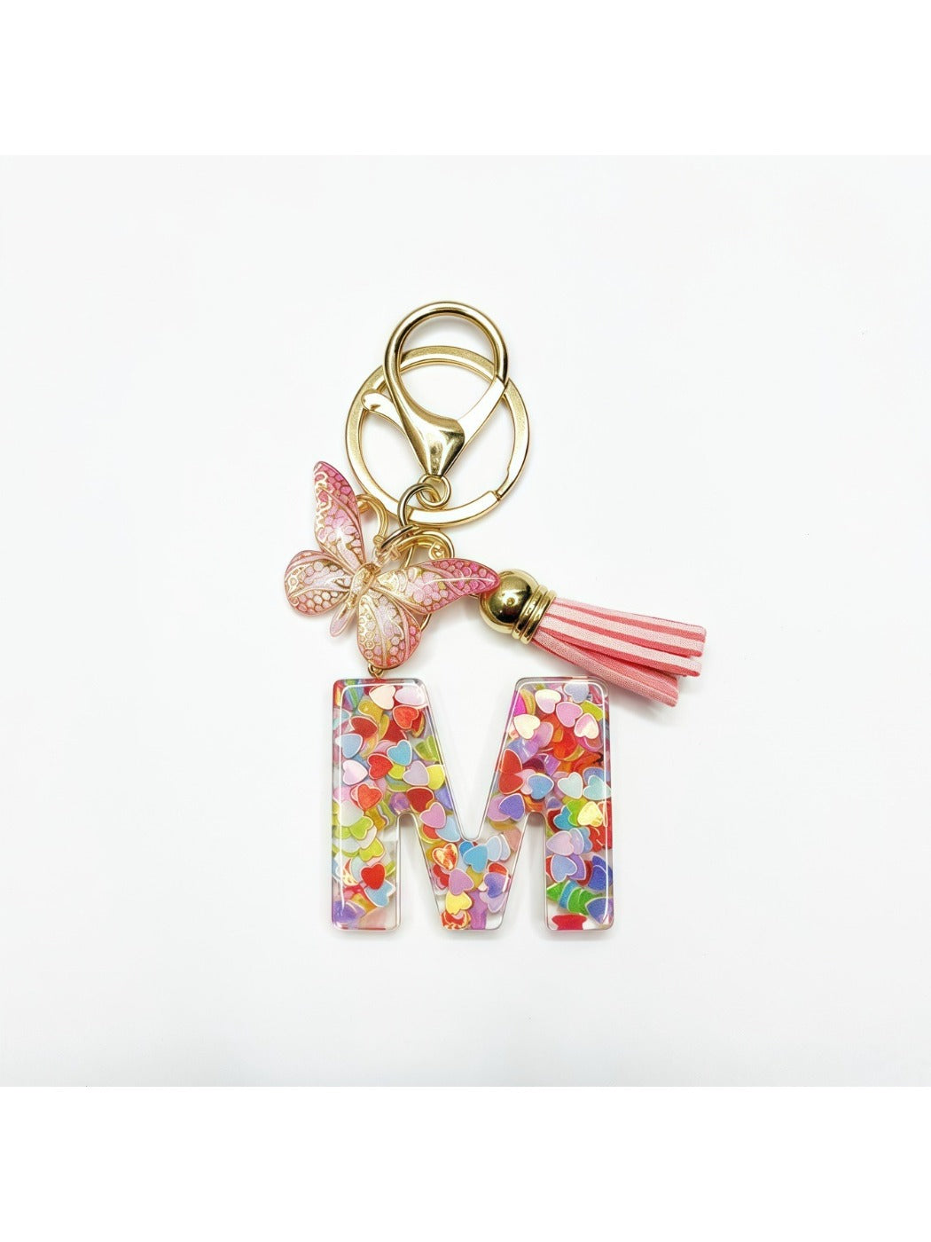 Butterfly and letter pendant keychain displayed with a small gift box
