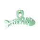 Beau fishbone acetate hair clip next to matching accessories on a table