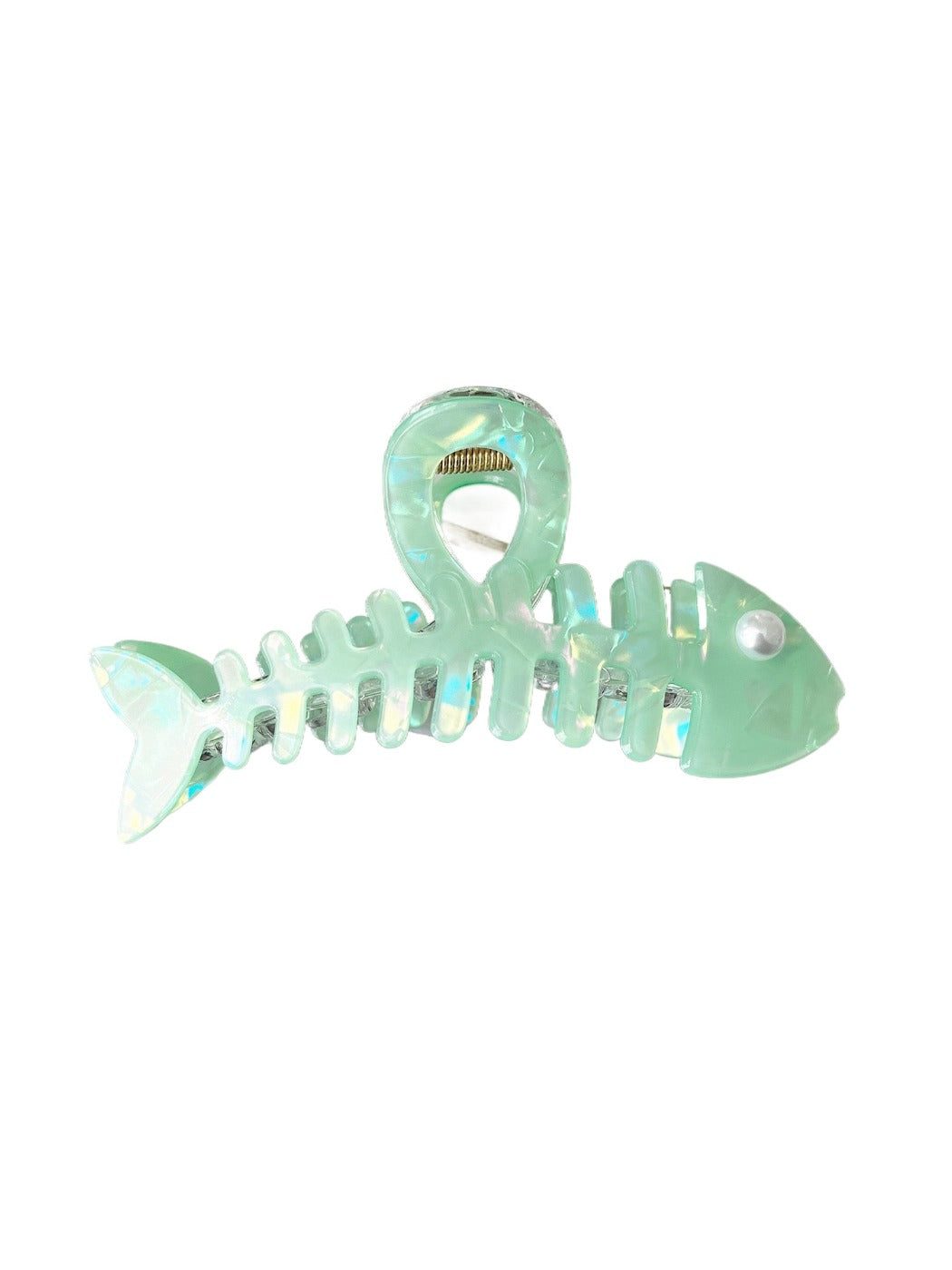 Beau fishbone acetate hair clip next to matching accessories on a table