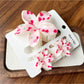 Pastel purple flower shaped claw clip on a wooden surface