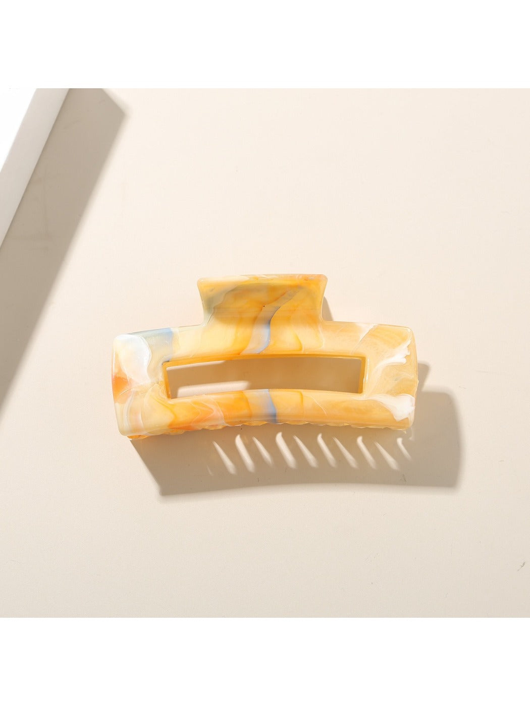Beau rectangular hair clip shown from above, emphasizing its rectangular shape and glossy finish