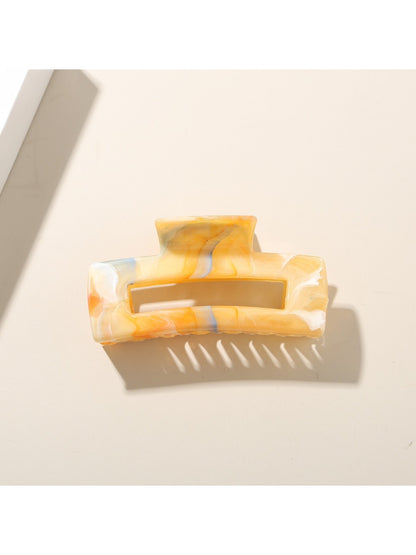 Beau rectangular hair clip shown from above, emphasizing its rectangular shape and glossy finish