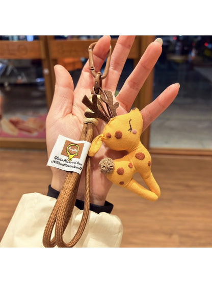 Side view of Keypus deer charm showing detailed enamel and metal edges