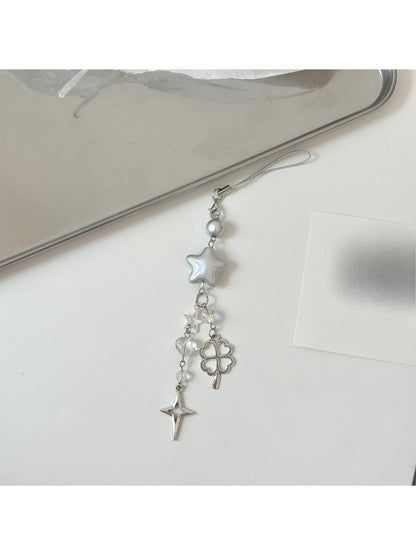Star keychain displayed on a flat surface highlighting holographic effect