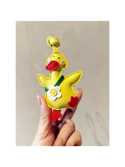 Duck keychain displayed on a white background with a shadow underneath