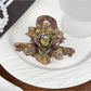 Beau classic lotus shaped hair claw clip in beige shown from multiple angles