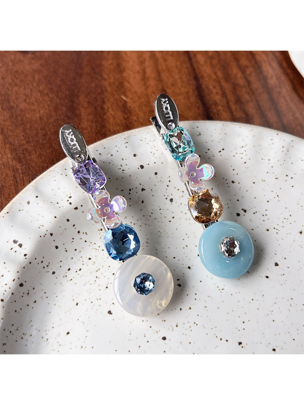 Side view of Beau rhinestone hair clip highlighting the clip mechanism and colorful stones