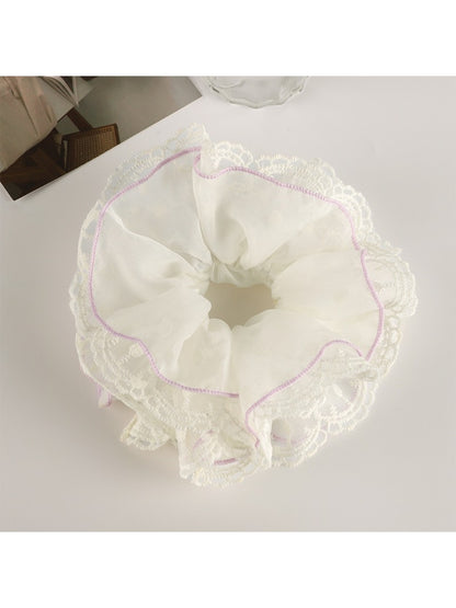 Multiple Gifty scrunchies in different pastel colors arranged in a circle