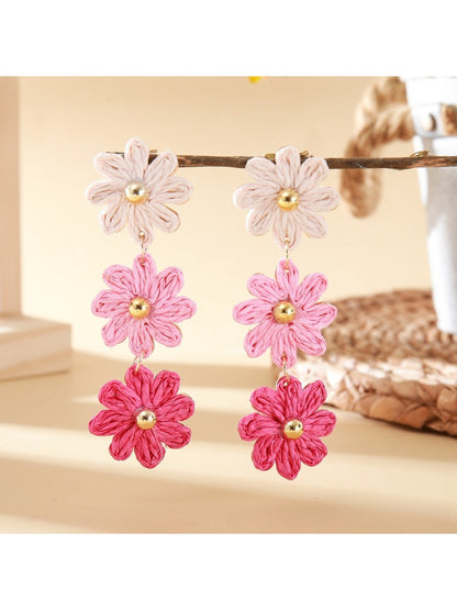 Earrings featuring colorful flower design with drop style hooks