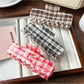 Beau plaid updo claw clip shown closed on a white background