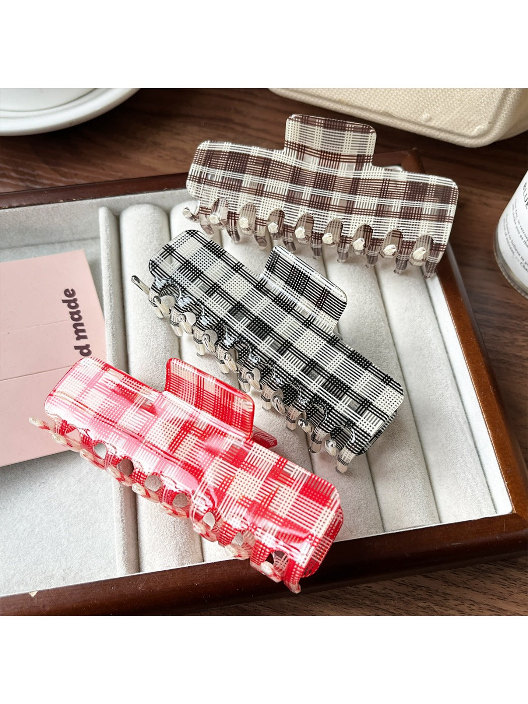 Beau plaid updo claw clip shown closed on a white background