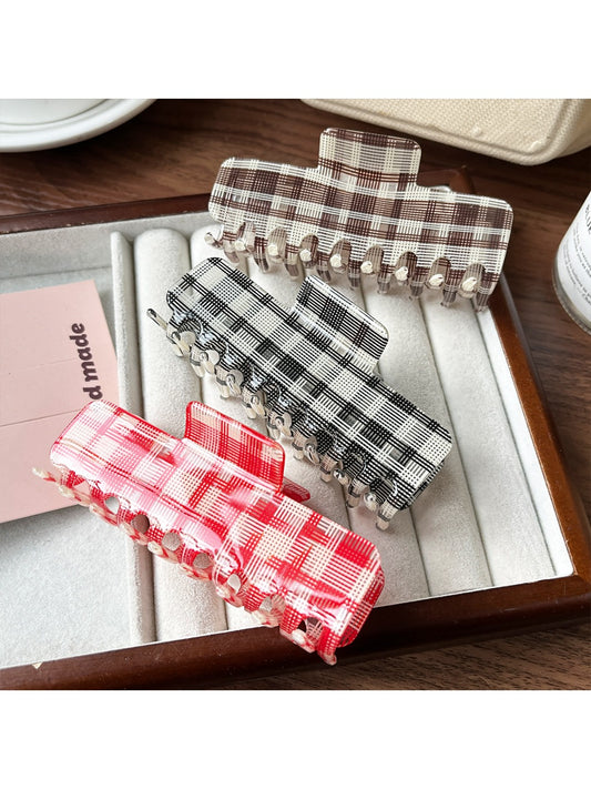 Beau plaid updo claw clip shown closed on a white background