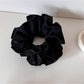 Gifty Sweet Style floral print scrunchie displayed on a white background highlighting colors and design