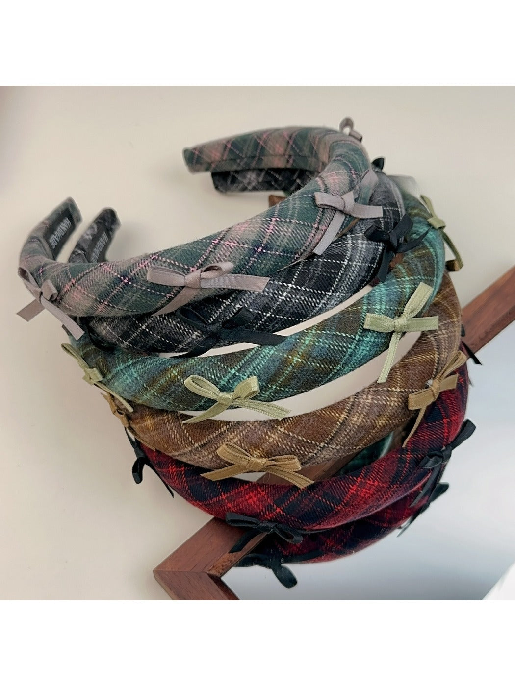 Side view of Gifty plaid bow headband highlighting bow shape