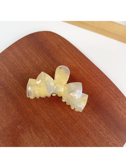 Beau bow shaped hair claw clip in beige with smooth matte finish