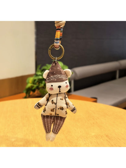 Side view of the bear keychain showing detailed hat and facial features