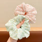 Top view of Gifty tiny floral print scrunchie showing fabric texture