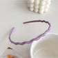 Gifty wavy headband in pastel pink color styled with casual outfit