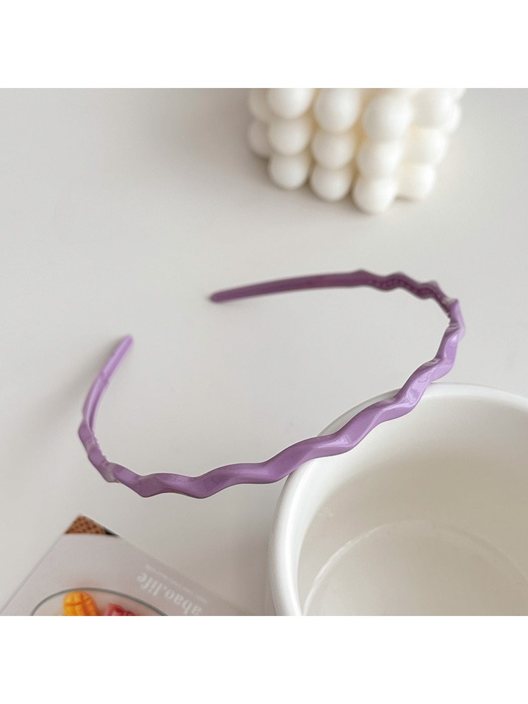 Gifty wavy headband in pastel pink color styled with casual outfit