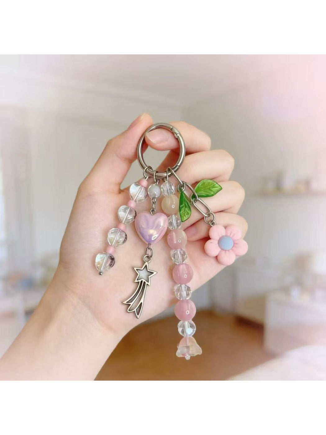 Keypus beaded heart charm keychain attached to a set of keys on a wooden surface