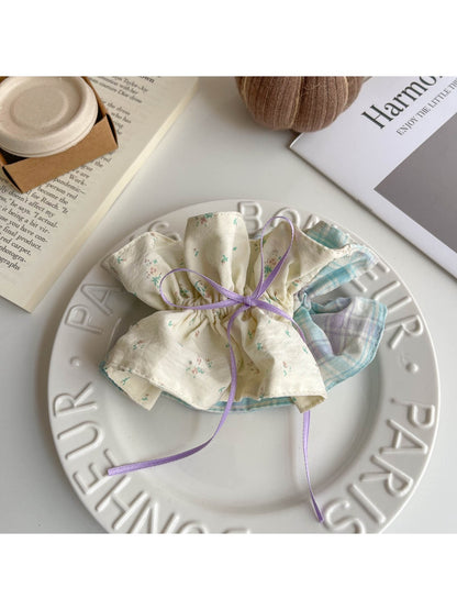 Gifty scrunchie headband and hair clip displayed together on a flat surface