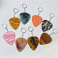 Close-up of Keypus textured teardrop charm keychain in silver finish
