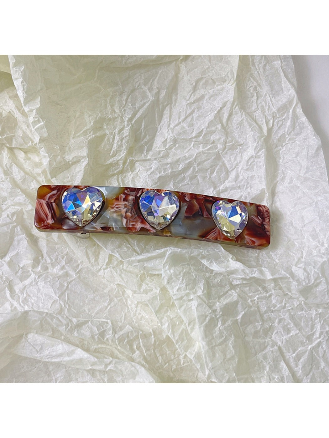 Blue and green square hair clips shown from side angle highlighting thickness