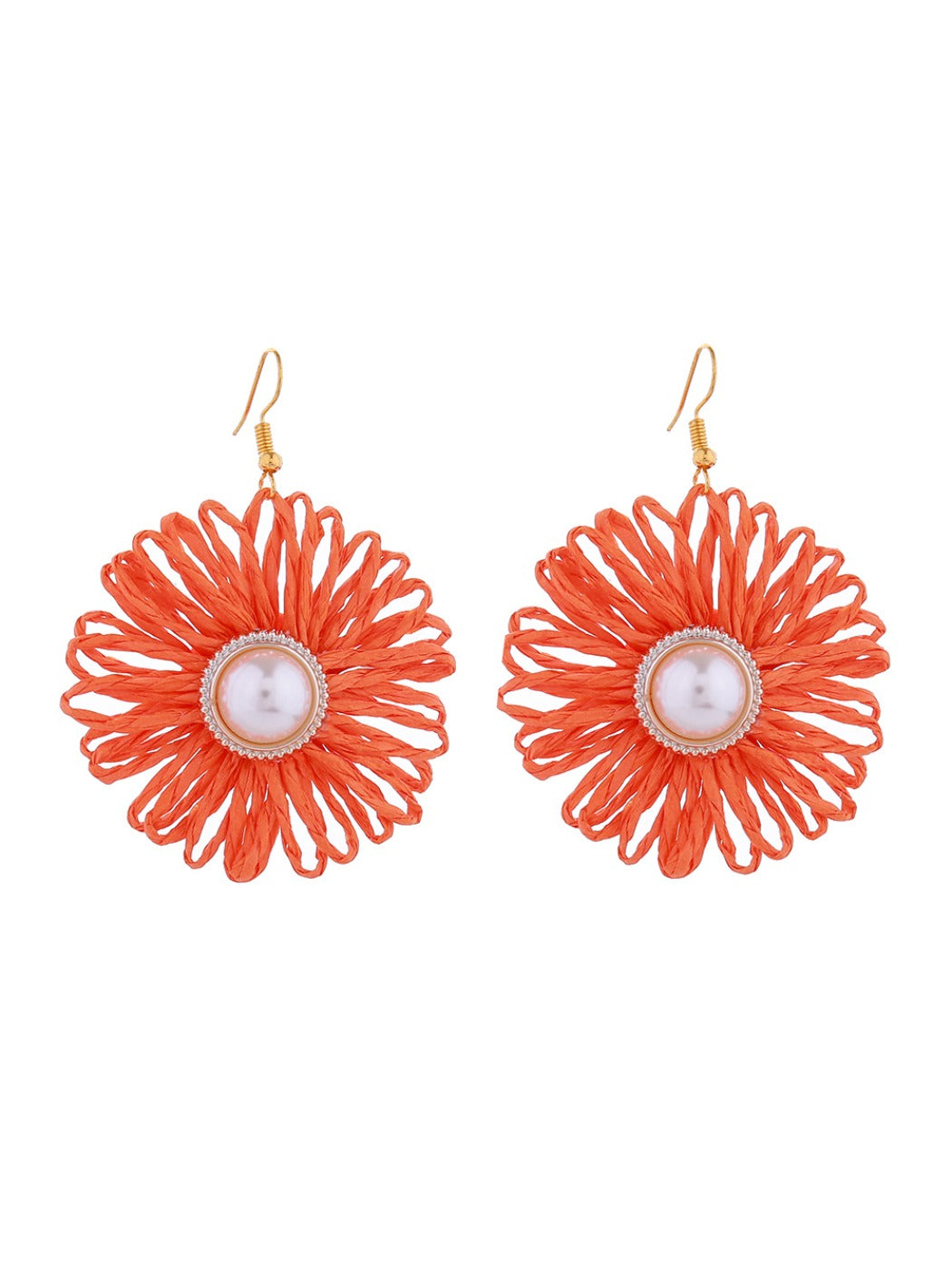 Earedge raffia woven flower-shaped earrings hanging from a jewelry stand