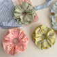 Close-up of Gifty color block stripe print scrunchie showing fabric texture
