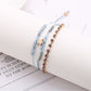 Close-up of clasp and beadwork on Lovra Five Point Star Bead Woven Bracelet