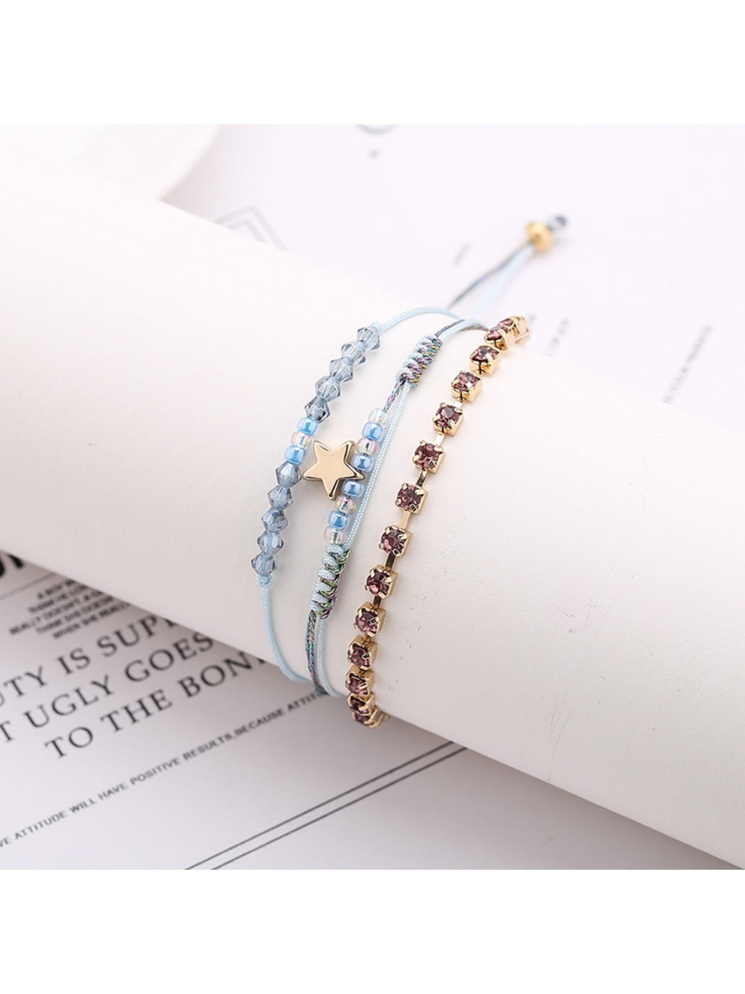 Close-up of clasp and beadwork on Lovra Five Point Star Bead Woven Bracelet