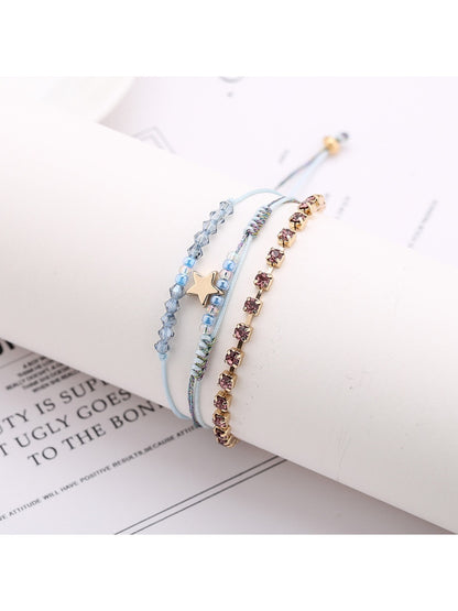 Close-up of clasp and beadwork on Lovra Five Point Star Bead Woven Bracelet