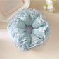 Close-up of lake blue floral scrunchie showing fabric texture and layers