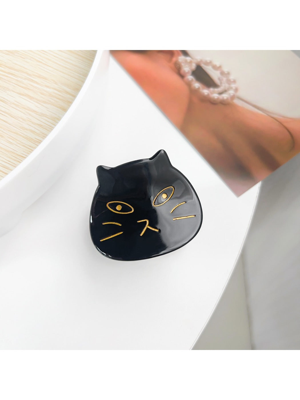 Beau hair claw clip displayed with packaging box in background