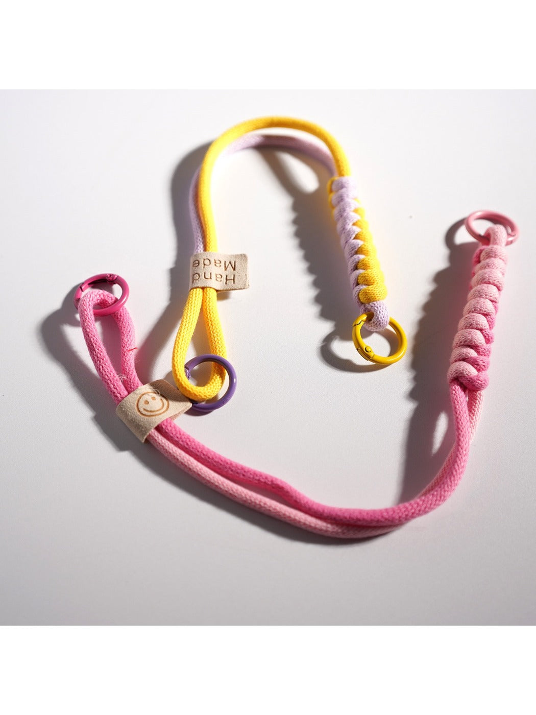 Close-up of vibrant twisted rope keychain with silver keyring
