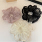 Close-up of Gifty modern minimalist solid color ruched scrunchie in soft fabric