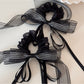 Gifty layered ribbon scrunchie displayed with matching pastel hair clips