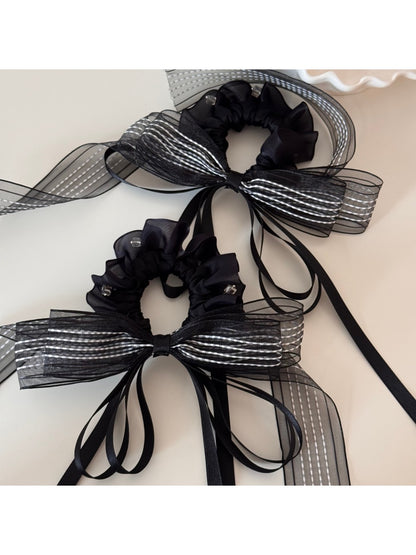 Gifty layered ribbon scrunchie displayed with matching pastel hair clips