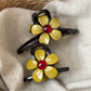 Beau minimalist flower-shaped decor claw clip in beige on white background